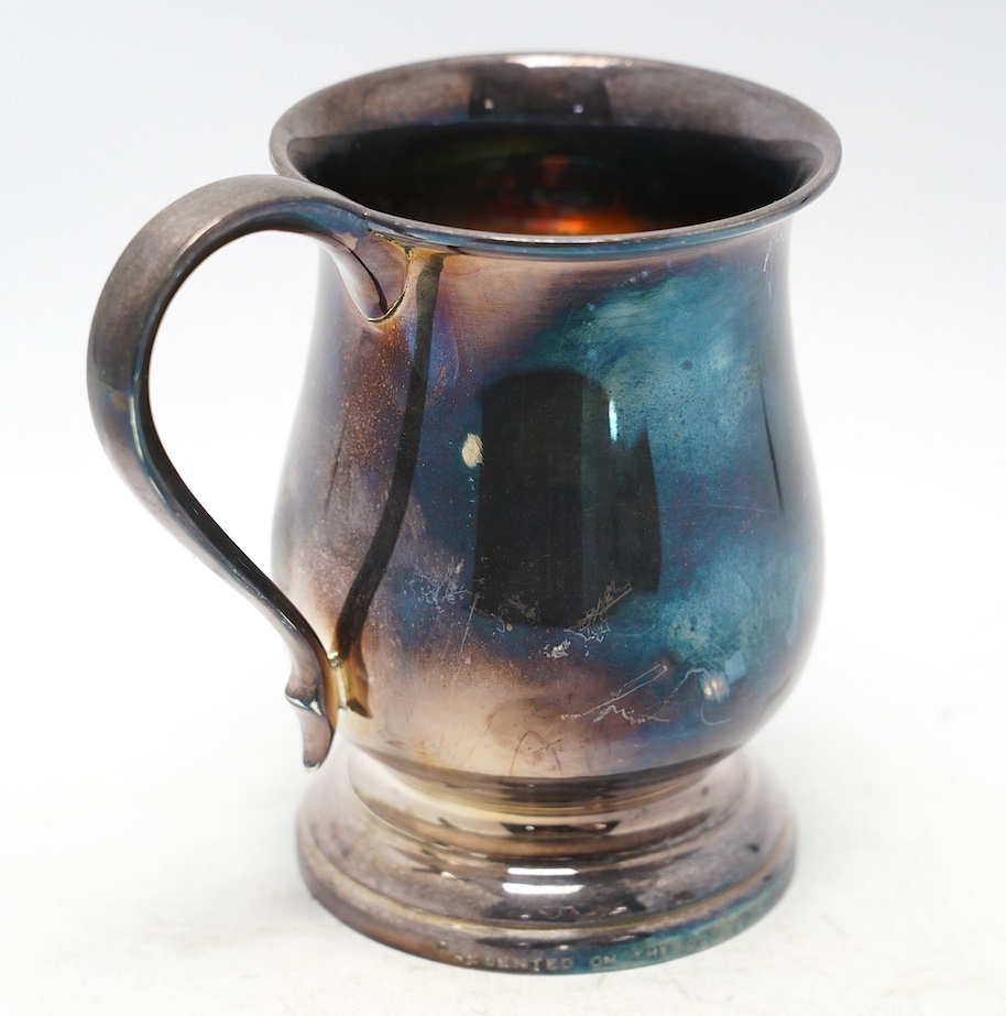 A George V silver baluster mug, with later engraved inscription, Joseph Gloster Ltd, Birmingham, 1934, height 13.8cm, 10.9oz. Condition - fair